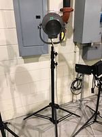 Full view of spotlight on tripod stand