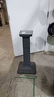 Full view of metal pedestal stand front