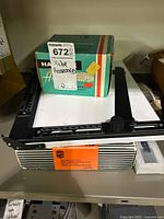 All three items together showing easel, film back, boxed slide viewer