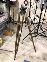 Full view of tripod standing, legs extended