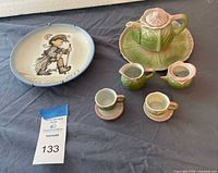 Front view of Hummel plate and full cabbage tea set