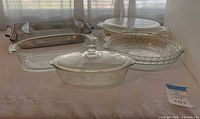 Group view of seven Pyrex glass baking and casserole pieces