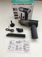 Vacuum, three nozzle attachments, USB cable, manual and box displayed