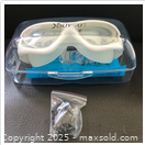 Goggles inside clear case with accessory bag