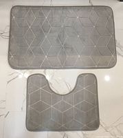 Both bath mats laid flat showing size and color