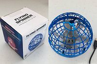 Box and flying orb spinner toy side by side