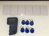 All contents: RFID writer, five white cards, blue key fobs