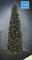 Slim pre-lit pencil Christmas tree illuminated, shows overall appearance and lighting
