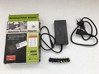 Retail box, adapter, AC cord, DC tips displayed