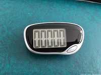 Front view showing LCD display with digits and reset button