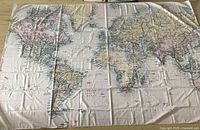 Full view of entire tablecloth showing world map design