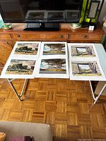 All six prints laid out on table