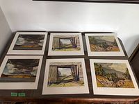 Six A.J. Casson prints laid out for overview