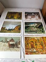 Six different Casson prints laid out two by three on bed