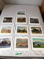 All ten different Casson print images laid out on bed