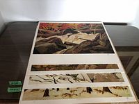 All four prints stacked showing main image and three narrow images beneath