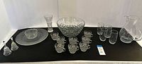 Full lot overview showing all 19 clear glass pieces