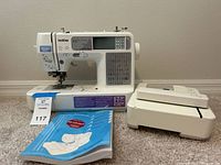 Front view of Brother SE-400 machine with embroidery unit and manual
