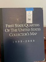 Front cover of First State Quarters collector map