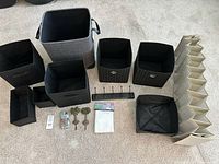 All items laid out including bins, hamper, organizer, hooks and small accessories