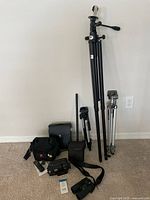 Group shot showing camcorder, tripods, binoculars, bags and accessories