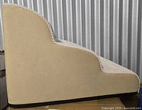 Left side profile of beige 3-step foam dog stairs showing shape and black base