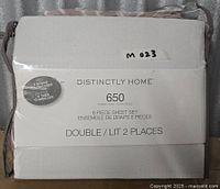 Front of Distinctly Home sheet set package displaying brand, thread count and size