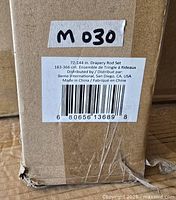 Barcode label on box showing product details and size range