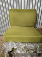 Olive green seat and back cushion on box