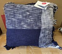 Front view of navy and white woven square pillow