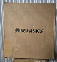 Sealed Rev-A-Shelf branded shipping carton containing the polymer full circle lazy Susan kit