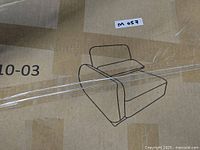 Sealed box with line drawing of right-arm chair and label M 057