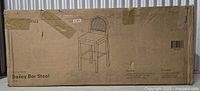 Sealed shipping carton showing product outline and name Bailey Bar Stool