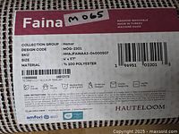 Close-up of product label showing model, size, material and brand