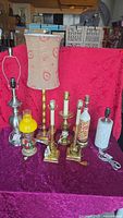 Group shot of all eight table lamps showing variety of styles and one with fabric shade