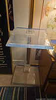 Overall view of clear Lucite side table