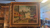 Front view of framed Villanova street scene painting