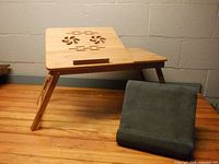 Bamboo laptop tray and gray Flippy stand displayed together