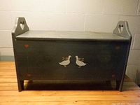 front view of blue bench with duck motif and heart cutouts