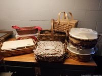 Group of seven baskets with liners, lids and inserts displayed together