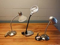 All three task lamps side by side on table