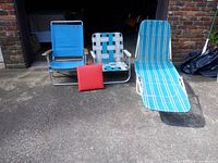 Group shot of all four items: chaise lounge, two beach chairs, stadium cushion
