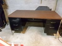 Front view of Steelcase desk showing drawer configuration and chrome legs