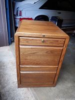 Front view of Encore oak filing cabinet showing two drawers and lock