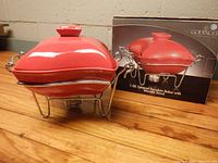 Baker on stand beside box