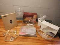 Group shot of all six glass/crystal serving pieces with some original boxes visible