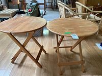 Both folding tables side by side, tops and bases visible