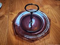 Top view of octagonal purple glass platter with metal handle