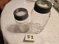 Overview of both jars with lids and metal bands
