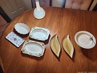 All seven serving pieces arranged on table